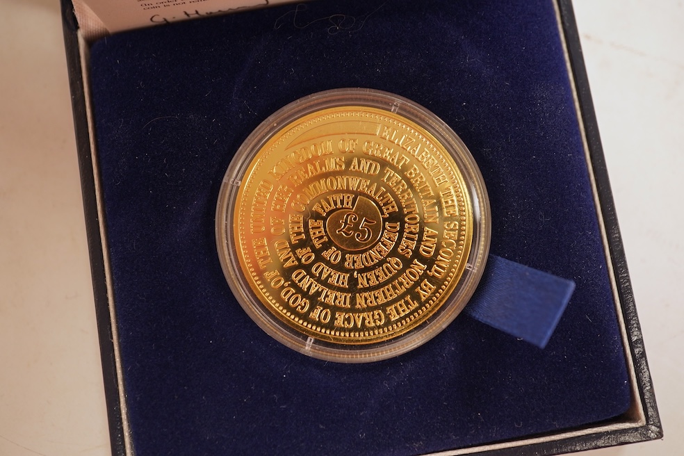 A collection of cased silver and cupro nickel proof and uncirculated sets and coins, including four Royal Mint UK proof coin year sets for 2002-2005, Royal Mint UK silver proof £2, London mint office silver commemorative